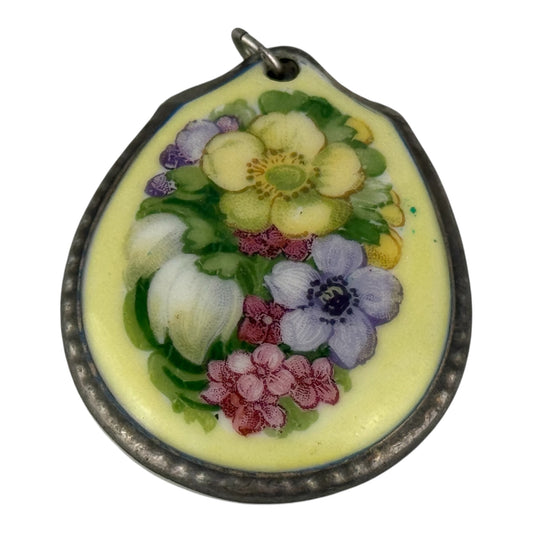 Floral pendant with a yellow background on a white background